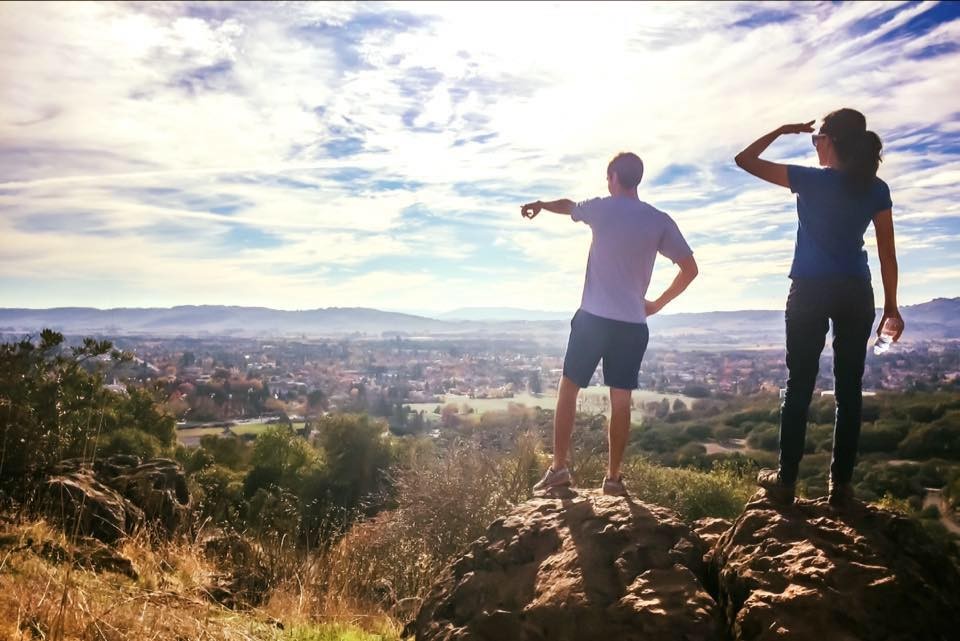 Two people staying at the top of Sonoma Overlook Trail in the fall